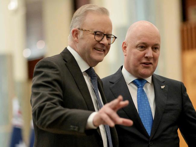 Australia's Prime Minister Anthony Albanese (L) guides New Zealand's Prime Minister Christopher Luxon after the signing of the visitor's book at Parliament House in Canberra on August 16, 2024. (Photo by TRACEY NEARMY / POOL / AFP)