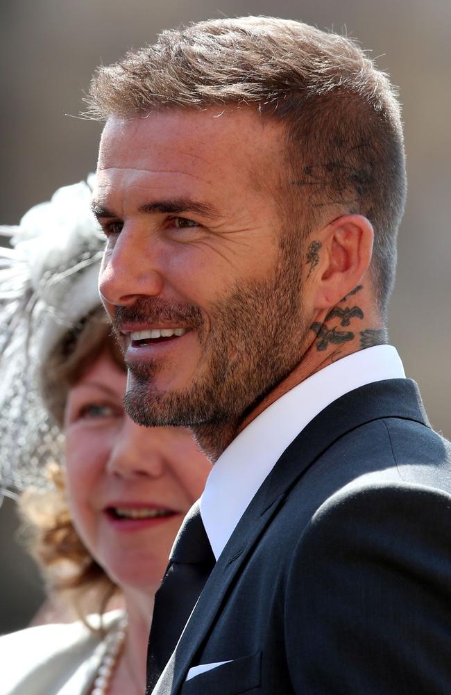 David Beckham looked fresh-faced, even with the fresh new scalp ink. Picture: AFP / /CHRIS RADBURN