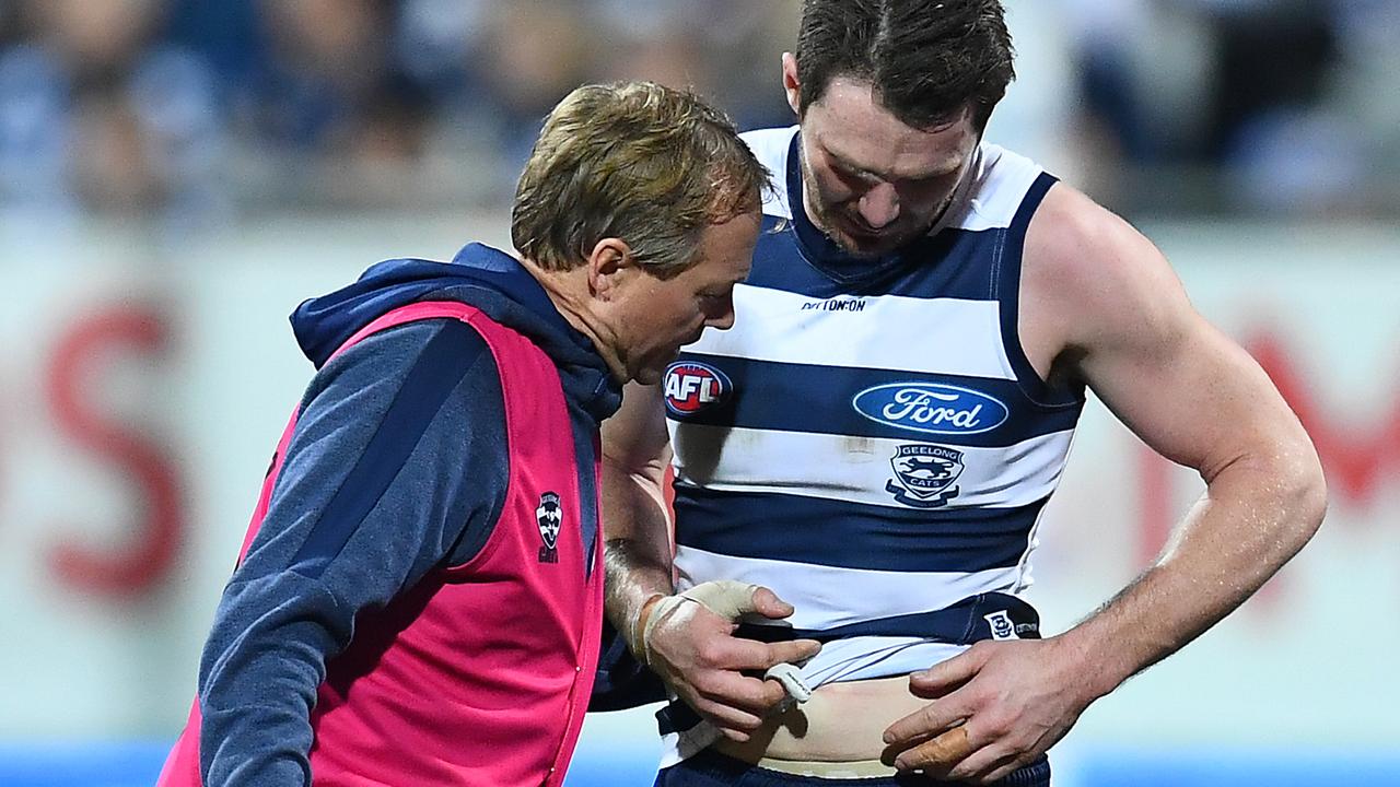 Patrick Dangerfield of the Cats is seen by the doctor on Friday night. Picture: Quinn Rooney/Getty Images