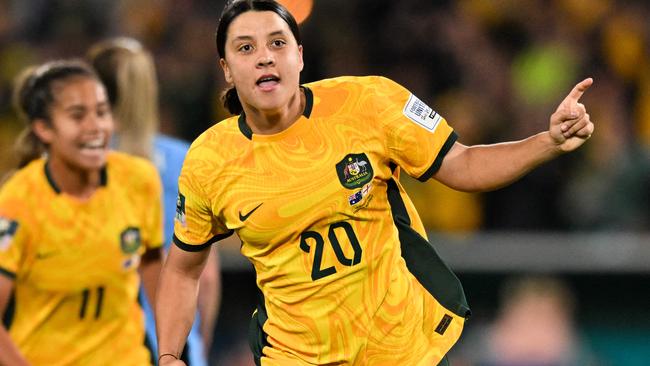 FILES-- This file photo taken on August 16, 2023 shows Australia's forward Sam Kerr celebrating scoring her team's first goal during the Australia and New Zealand 2023 Women's World Cup semi-final football match between Australia and England at Stadium Australia in Sydney. Chelsea and Australian women's football star Sam Kerr has been charged with a "racially aggravated offence" in Britain following a dispute involving a police officer, London's Metropolitan Police said March 4.  The 30-year-old striker, one of the highest profile and best-paid players in the women's game, was charged following an incident in London in January 2023, a police statement read. (Photo by IZHAR KHAN / AFP)