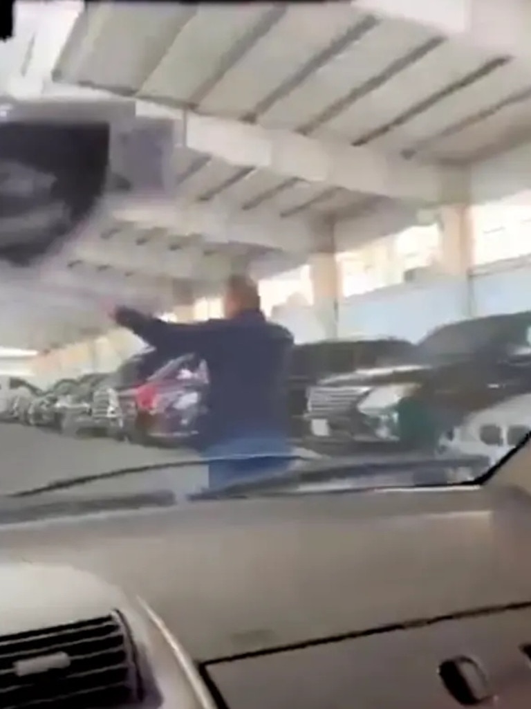 Videos shared on social media show gleeful looters touring a large garage. Picture: X.