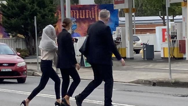 Sisters Lara Buttriss (white blonde with scarf covering her hair) and Grace Buttriss (brunette). Picture: Adelaide Lang