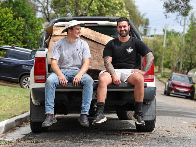 Henry Swindon and Dylan Conway in the Ute Army helping out following the flooding caused by ex-Tropical Cyclone Alfred in Oxley. Picture: Tara Croser