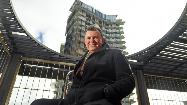 Guava Lime’s Michael Loucas in front of the One apartments on Flinders St. Picture: Tom Huntley