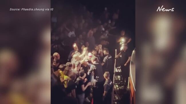 Lead singer of Suede angrily rips phones from concert goers hands