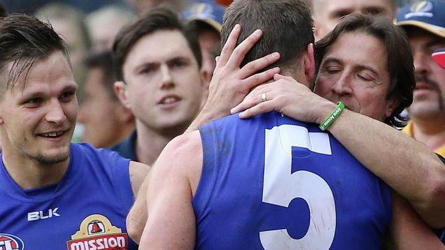 Matthew Boyd gets a hug from Luke Beveridge after the Grand Final. Picture: Wayne Ludbey