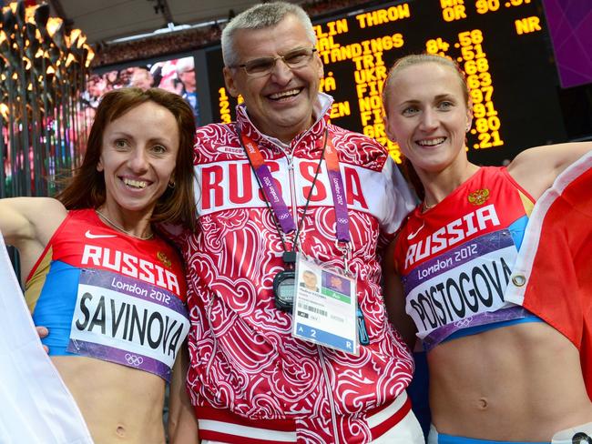 Mariya Savinova (L) celebrating with Ekaterina Poistogova (R) and Russian coach Vladimir Kazarin.