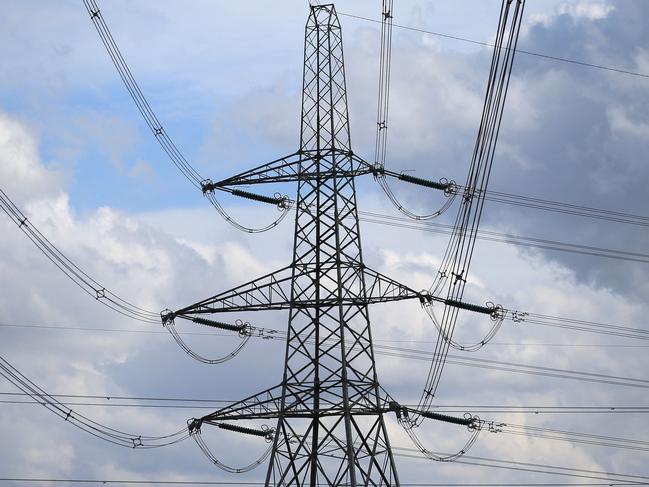 Electricity pylons hold power cables leading away from the SSE (Scottish and Southern Energy) gas-fired Keadby Power Station near Scunthorpe in northern England on September 6, 2022. - New UK Prime Minister Liz Truss inherits an economy set to enter recession before the end of the year, with double-digit inflation forecast to soar further. British households are facing an eye-watering 80-percent average hike in electricity and gas bills from next month, in a dramatic worsening of the cost-of-living crisis before winter. (Photo by Lindsey Parnaby / AFP)