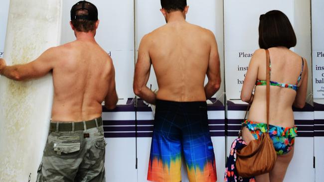 Australia: the only country on Earth where people vote in bikinis and board shorts. Picture: Braden Fastier