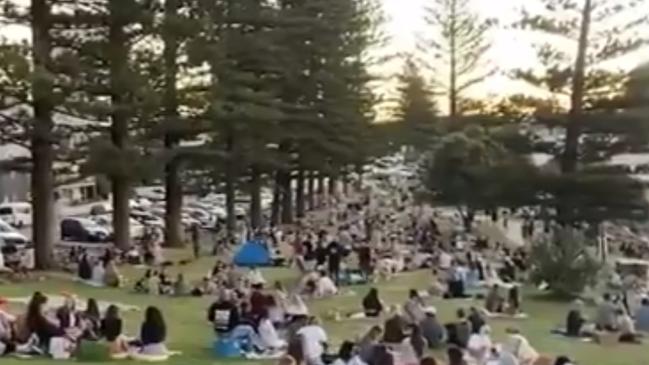 Huge crowds packed Burleigh Hill this afternoon. Picture: Nine News.