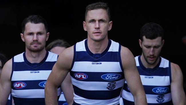 Joel Selwood of the Cats leads the team out during the Round 4 AFL match between the Melbourne Demons and the Geelong Cats at the MCG in Melbourne, Sunday, June 28, 2020. (AAP Image/Michael Dodge) NO ARCHIVING, EDITORIAL USE ONLY