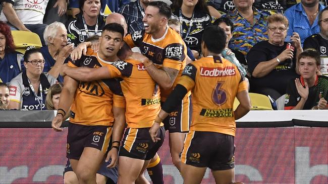 David Fifita is mobbed by his Broncos teammates after scoring a 70-metre solo try Picture: Getty Images