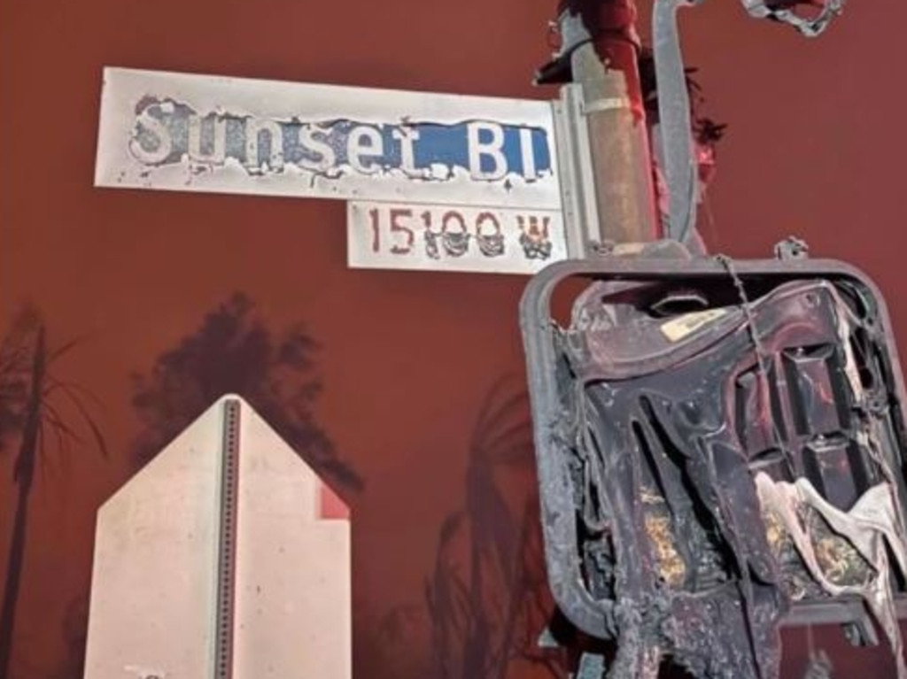 The charred remains of the iconic Sunset Boulevard street sign in Los Angeles. Picture: Supplied