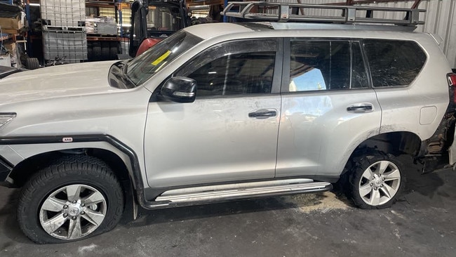 The stolen silver Toyota Prado was found damaged and covered in graffiti after police stopped it with tyre spikes following four days of being driven around Townsville.