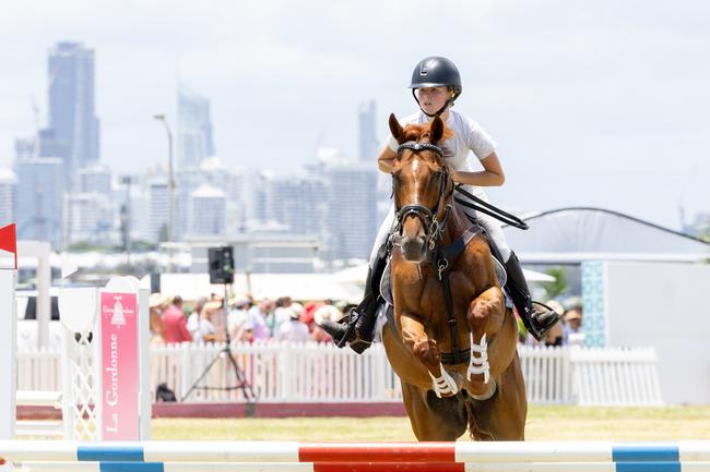 Makaylah Fenwick wins the Off The Track Cup at the Magic Millions Showjumping and Polo. Picture by Luke Marsden.