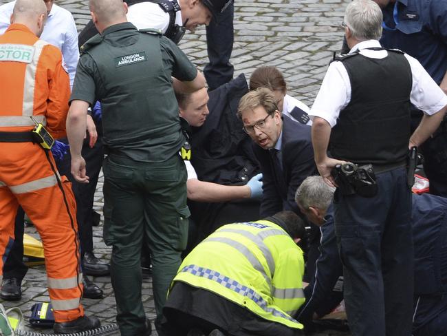 UK foreign minister Tobias Ellwood went to the help of the stabbed policeman. Picture: AP