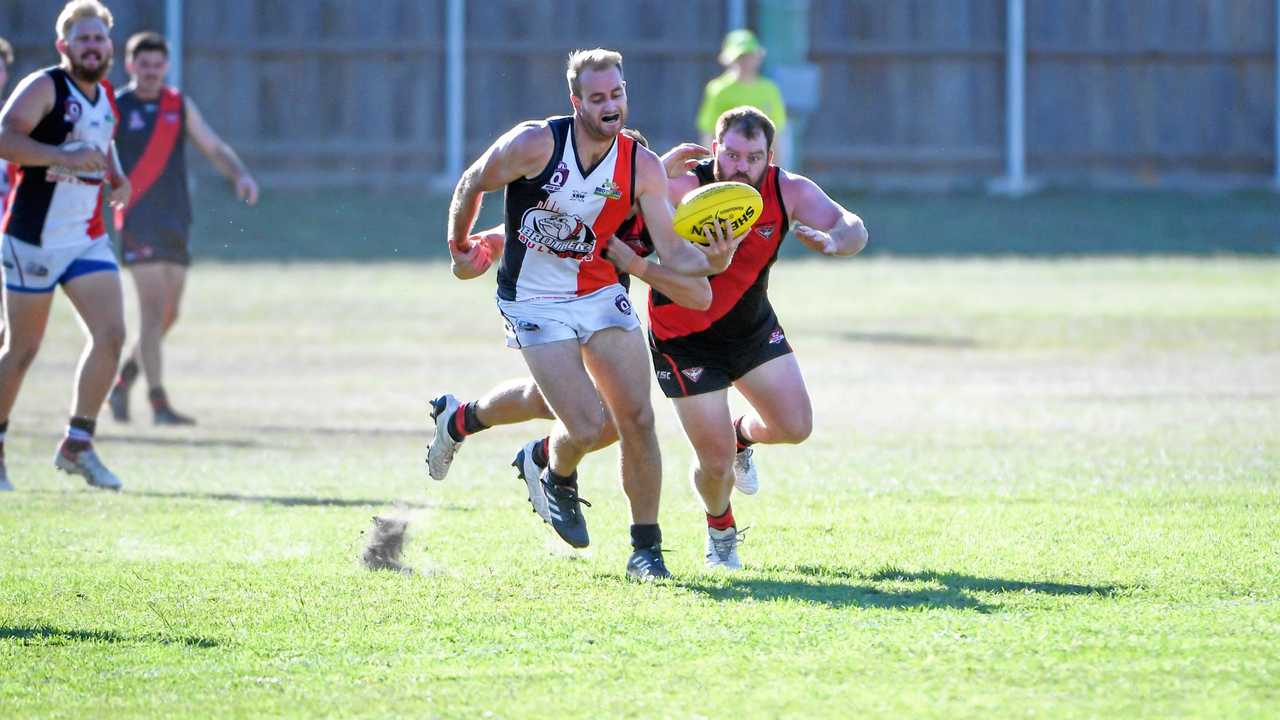 Benjamin Davis shrugs the tackle to clear the ball for the Brothers Bulldogs during last week's clash against Hervey Bay. Picture: Brian Cassidy