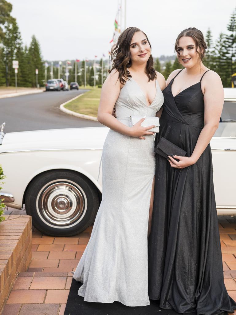 Naomi (left) and Jasmine Kukulka arrive at Wilsonton State High School formal at USQ, Wednesday, November 18, 2020. Picture: Kevin Farmer