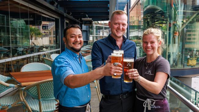 Manish Sen, Jack Riley and Lucy Tulloch at The Squire's Landing, which wants to trial 24/7 trading, on Monday.Picture: Justin Lloyd