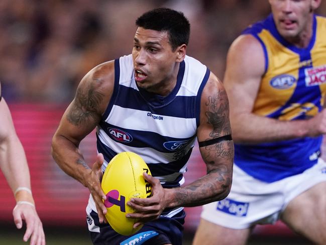 Tim Kelly of the Cats runs with the ball during the AFL First Semi Final match between the Geelong Cats and the West Coast Eagles in Melbourne, Friday, September 13, 2019.  (AAP Image/Michael Dodge) NO ARCHIVING, EDITORIAL USE ONLY