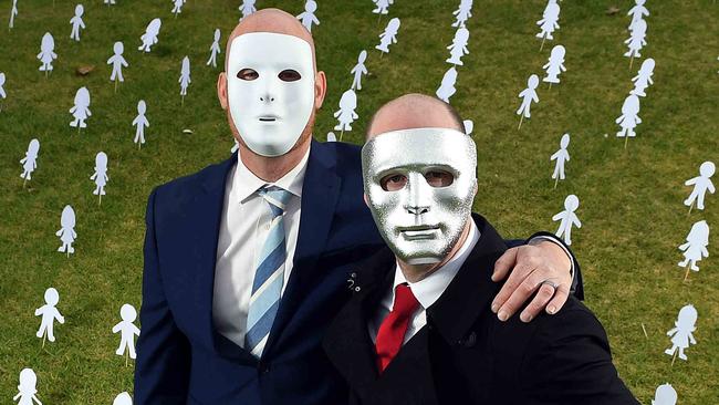 30/06/19 - Masked brothers "A" and "B" ahead of the final appeal hearing for sex predator Vivian Deboo. Surrounded by paper cut outs symbolising other victims who need help..Picture: Tom Huntley