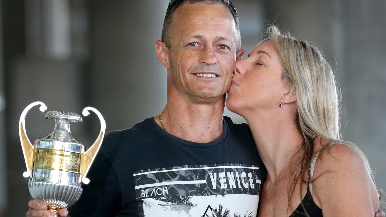 Jockey Damian Browne and his wife Kim celebrate his big win on Buffering after arriving back in Brisbane. Pic Darren England.