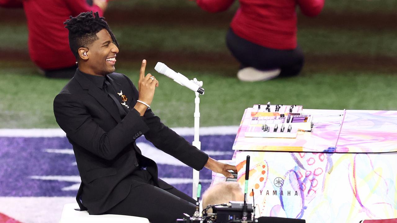 Jon Batiste at the piano. Photo by Cindy Ord/Getty Images.