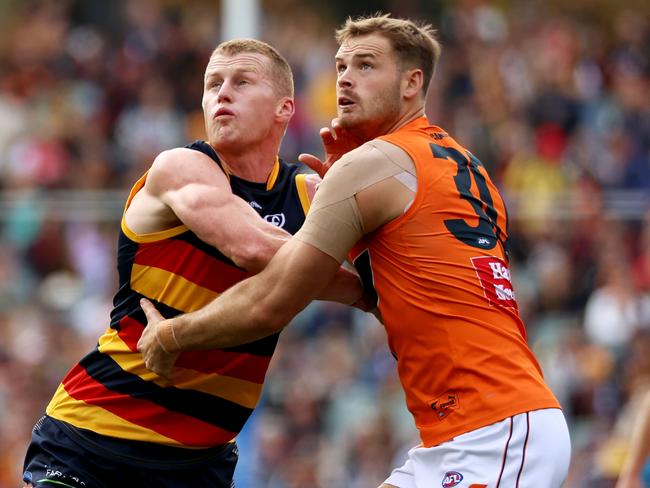 ADELAIDE, AUSTRALIA - APRIL 30: Reilly O'Brien of the Crows competes with Matt Flynn of the Giants during the 2022 AFL Round 07 match between the Adelaide Crows and the GWS Giants at Adelaide Oval on April 30, 2022 in Adelaide, Australia. (Photo by James Elsby/AFL Photos via Getty Images)