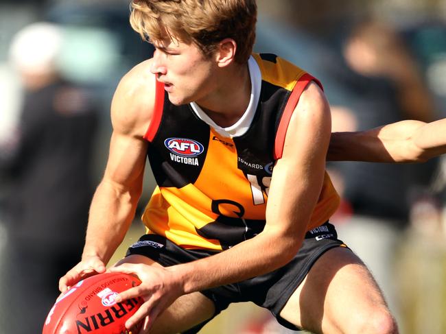 Melbourne Australia - July 15 Dandenong Stingrays number 18 Mitchell Riordan with the ball as 19 Christian Farchione attempts to tackle for the Northern Knights.TAC Cup: Dandenong Stingrays v Northern Knights.Picture: Stuart Milligan