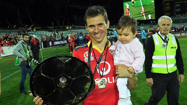 Former Adelaide United captain Isaias with the 21016 A-League championship trophy.