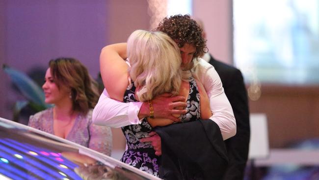 He hugged a blonde woman before leaving the party. Credit: Matrix.