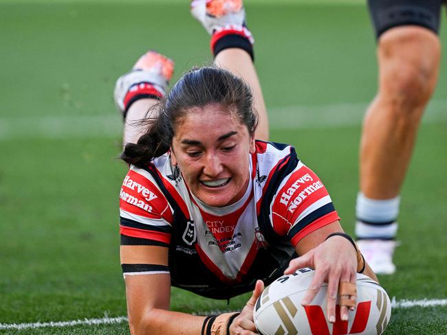 Sydney Roosters' Olivia Kernick scores a try during the National Rugby League (NRL) Women's Grand Final match between Sydney Roosters and Cronulla Sharks at Accor Stadium in Sydney on October 6, 2024. (Photo by Izhar KHAN / AFP) / -- IMAGE RESTRICTED TO EDITORIAL USE - STRICTLY NO COMMERCIAL USE --