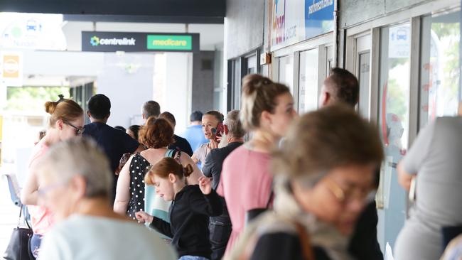 People queue outside Centrelink in Brisbane, Queensland. Picture: AAP