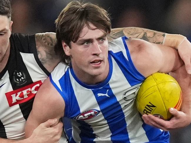 MELBOURNE, AUSTRALIA - JUNE 16: George Wardlaw of the Kangaroos is tackled by Jack Crisp of the Magpies during the round 14 AFL match between North Melbourne Kangaroos and Collingwood Magpies at Marvel Stadium, on June 16, 2024, in Melbourne, Australia. (Photo by Daniel Pockett/Getty Images)