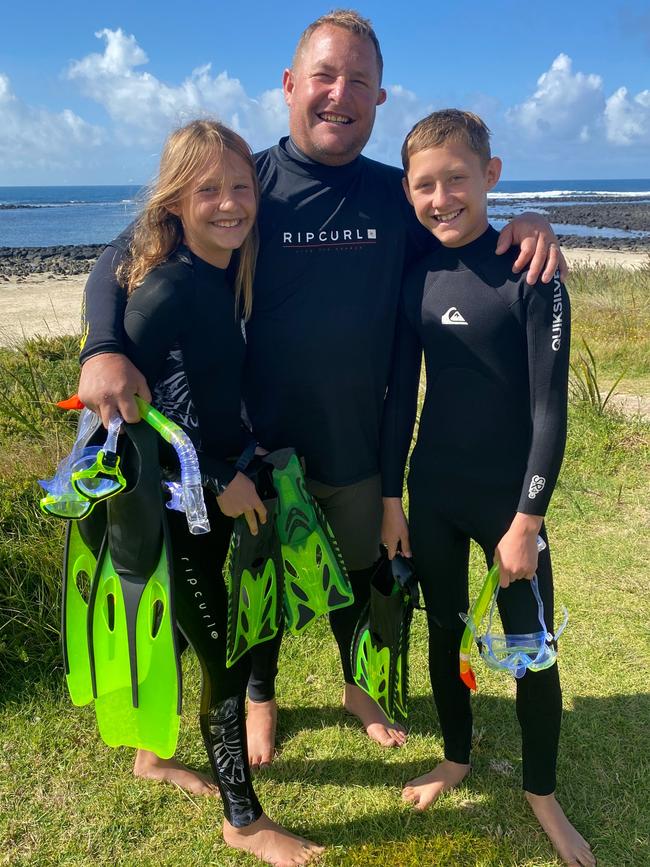 Brock with dad Craig and sister Mea, 11.