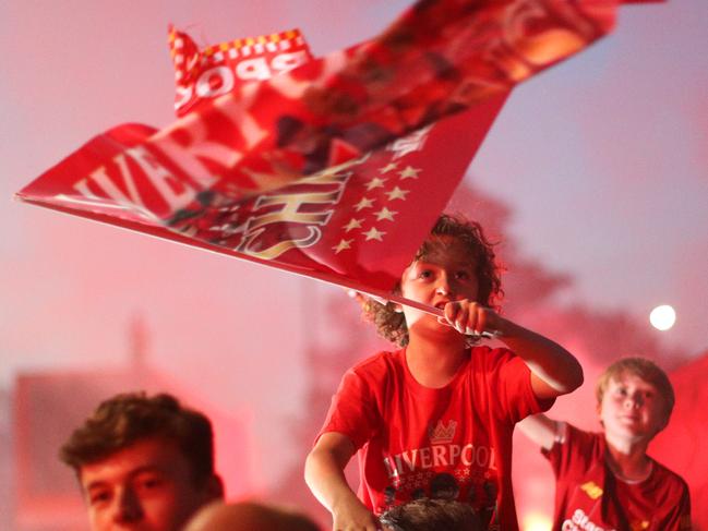 LIVERPOOL, ENGLAND - JUNE 25:  Liverpool fans celebrate as their team clinches the Premier League title at Anfield on June 25, 2020 in Liverpool, England. Liverpool are crowned Premier League champions as nearest rivals Manchester City fail to be Chelsea. Liverpool claim their first championship in 30 years. (Photo by Jan Kruger/Getty Images)