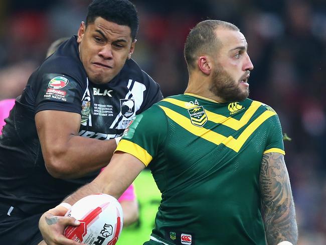 Blake Ferguson is tackled by David Fusitu'a during the Four Nations final.