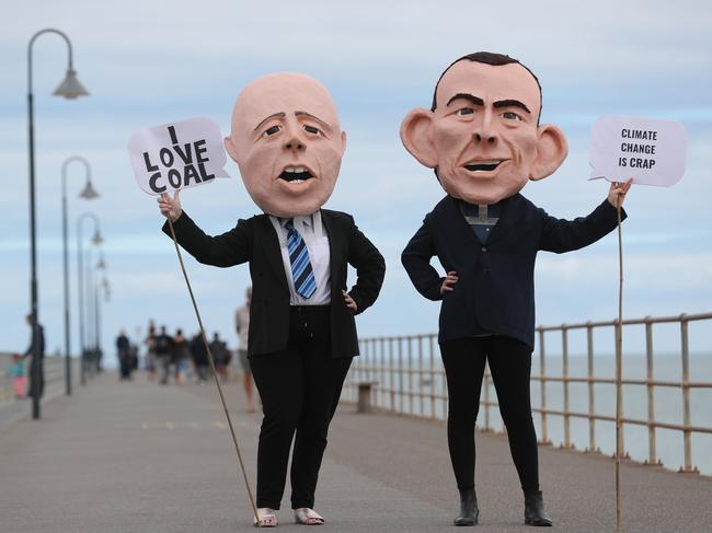 10.4.2019.GetUp members will be joined by National Director Paul Oosting and celebrated childrens entertainer Peter Coombe at Moseley Square,Glenelg calling for politicians to show climate leadership in securing a future for our kids.Giant Peter Dutton and Tony Abbott heads. PIC TAIT SCHMAAL.