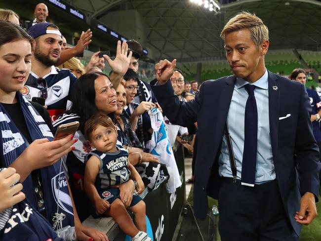 MELBOURNE, AUSTRALIA - DECEMBER 28: Keisuke Honda of Melbourne Victory signs autographs after the round 10 A-League match between the Melbourne Victory and the Wellington Phoenix at AAMI Park on December 28, 2018 in Melbourne, Australia. (Photo by Kelly Defina/Getty Images)