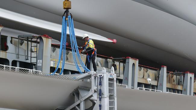 Huge wind turbine blades each 79 metres long are unloaded from the cargo ship Chipol Changjiang at the Port of Cairns, before being transported by road to the Kaban Green Power Hub near Ravenshoe. Picture: Brendan Radke