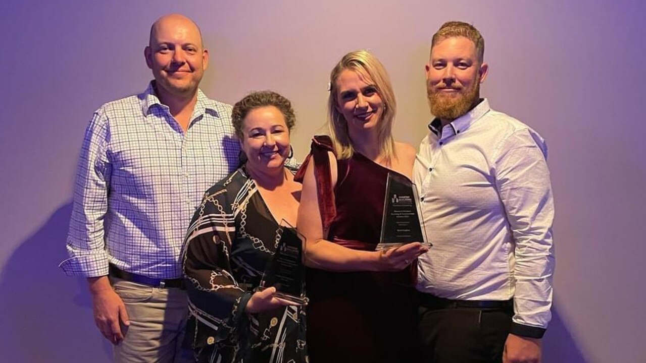 Display homeowners Mark and Meagan Benson with Hughes Elite Builders Mark and Jodie Hughes at the Master Builders Awards. Photo: Hughes Elite Builders