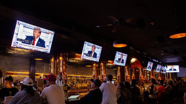 People watch Donald Trump's acceptance speech from inside a bar in Milwaukee, Wisconsin. Picture: Getty Images via AFP