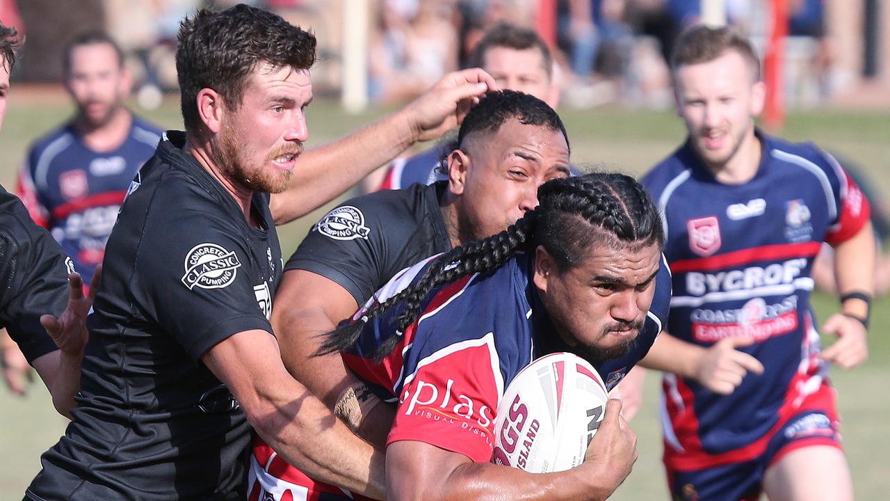 Mudgeeraba number six Dallas Wells attempts to make a tackle on Runaway Bay’s Andrew Vela. Picture: Mike Batterham