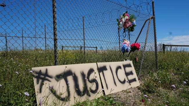 A sign calling for justice has appeared at the crash site where Ned and Nan Walker and their daughter Sue Skeer lost their lives in a head on collision in November 2020. Picture: Jessica Ball