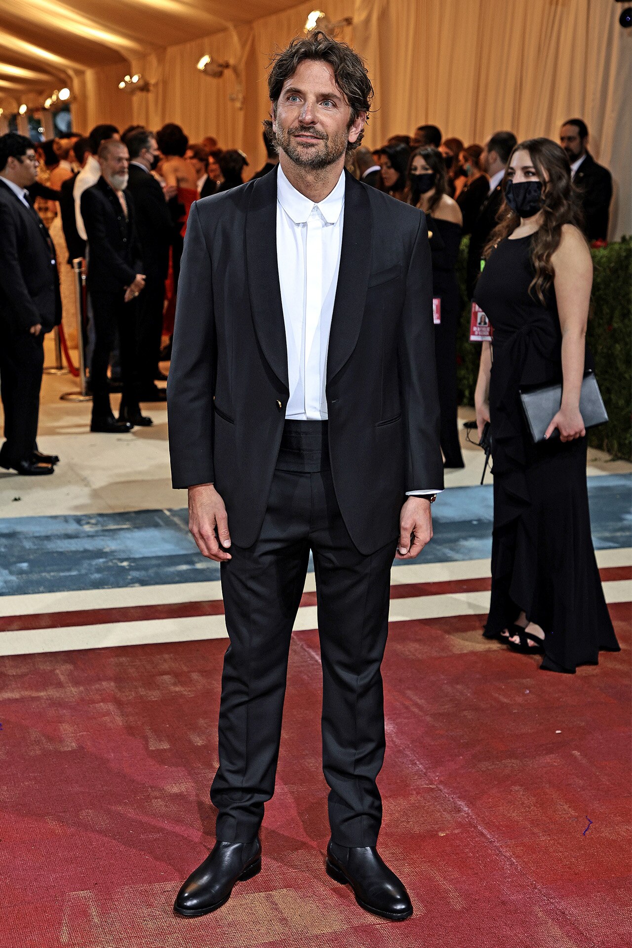 <p>Cooper spared the bow tie for the 2022 Met Gala, instead serving up a healthy dose of stubble and long hair, over a clean white button-up.&nbsp;</p>