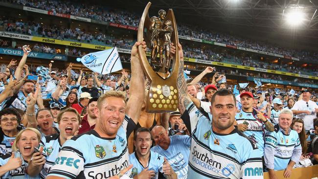 Matt Prior and Andrew Fifita celebrate with the trophy after Cronulla’s NRL grand final victory.