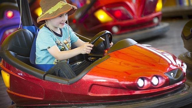 Beep beep ... Aaron Smith, 5, of Blaxland, was one of the 45,000 youngsters who bumped their way through the Kids’ Dodgems ride. Picture: Melvyn Knipe