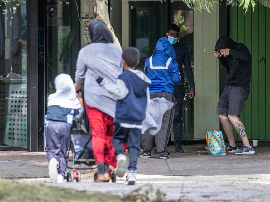 Children walk past intoxicated people. Richmond supervised injecting room on Lennox street.