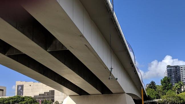 A picture posted on Reddit shows a Lime scooter hanging from Brisbane’s Victoria Bridge.