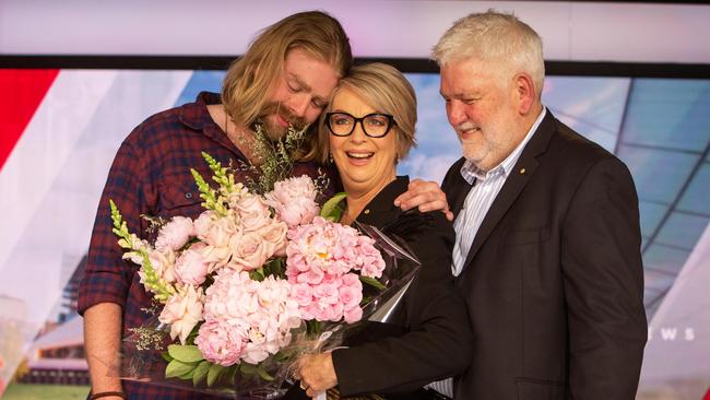 Adelaide media icon Jane Doyle with her son Henry and husband Ian after her last news bulletin. Picture: Emma Brasier